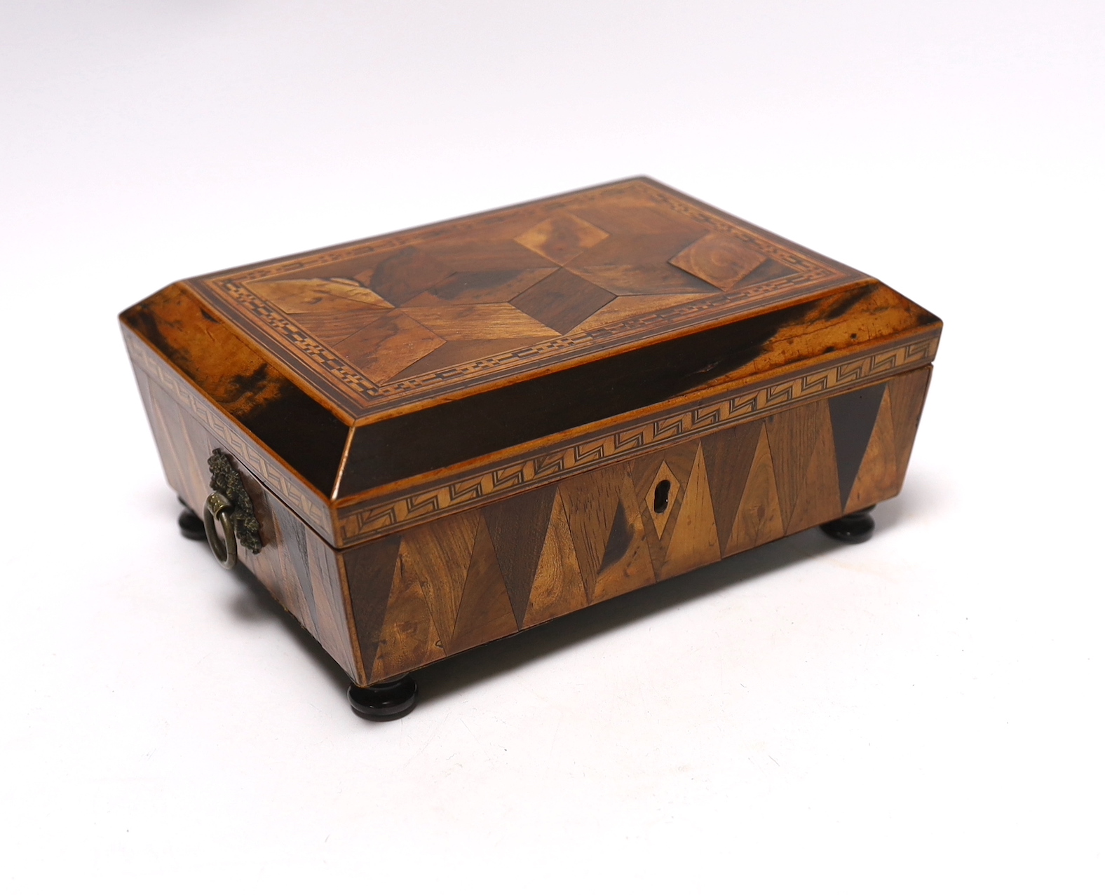 An early 19th century specimen wood, perspective cube marquetry box, 20.5cm wide, 9cm high, 15cm deep